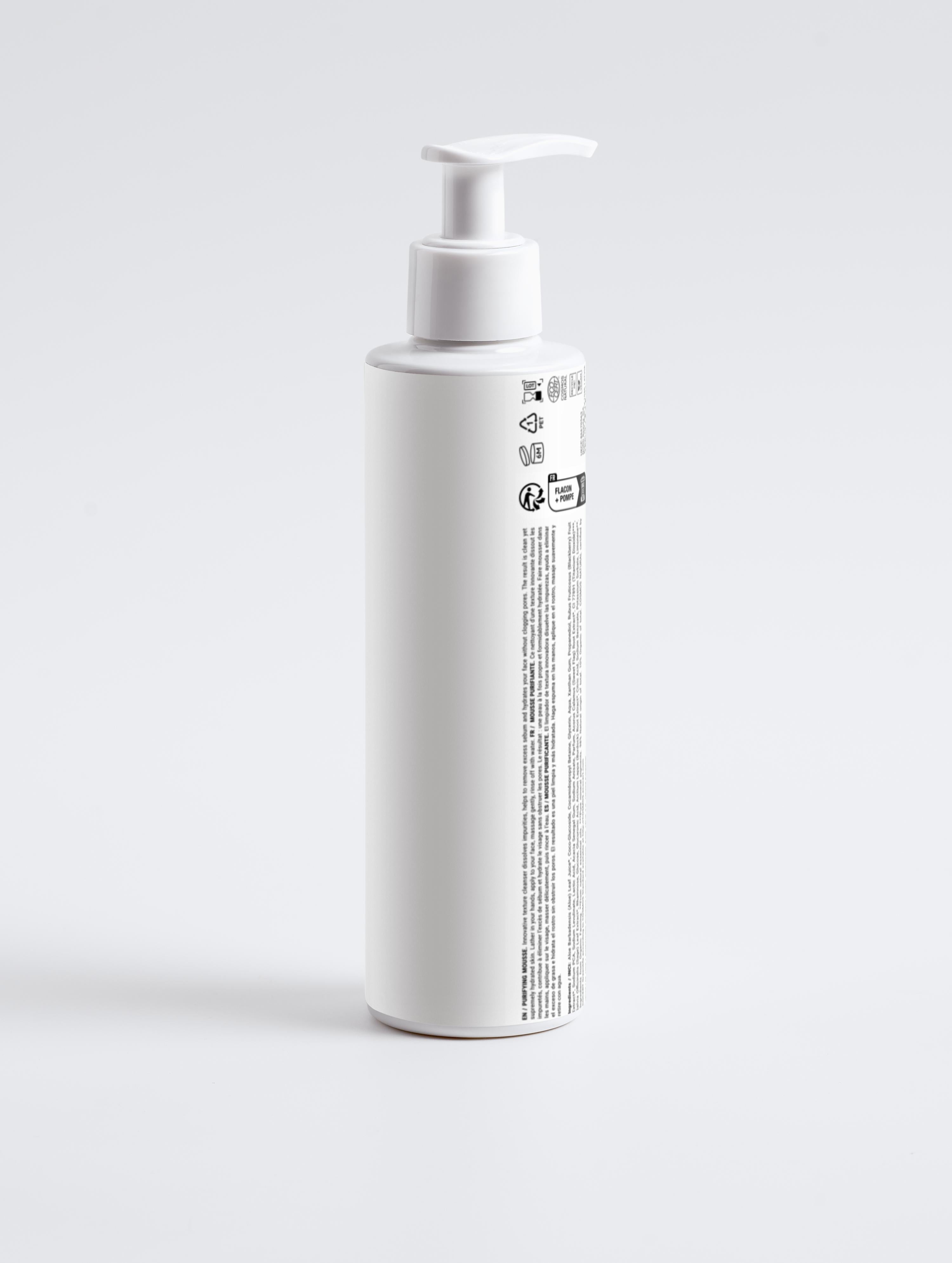 White bottle with pump on a light gray background