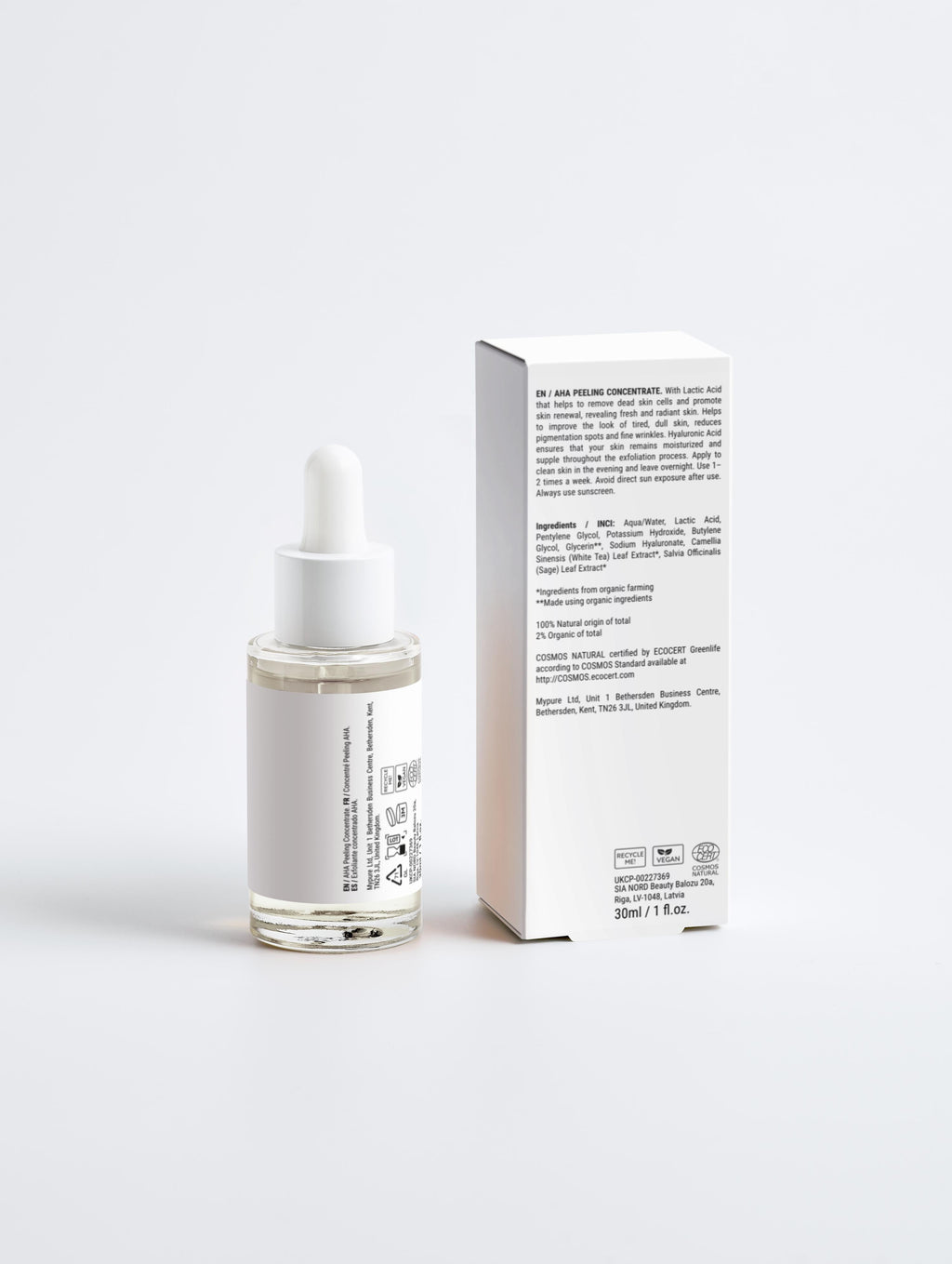 Skincare serum bottle with dropper and its packaging on a white background