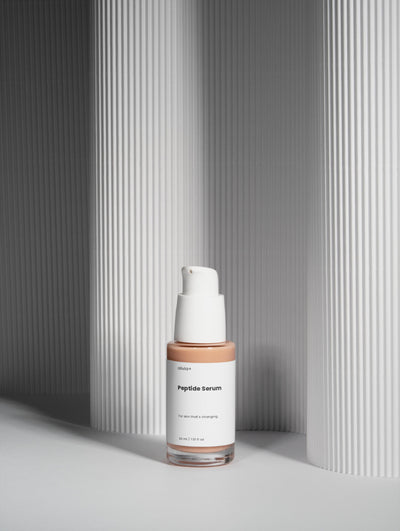 NutriFit skincare bottle on a gray background
