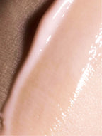 Close-up of a smooth, beige-colored skin texture