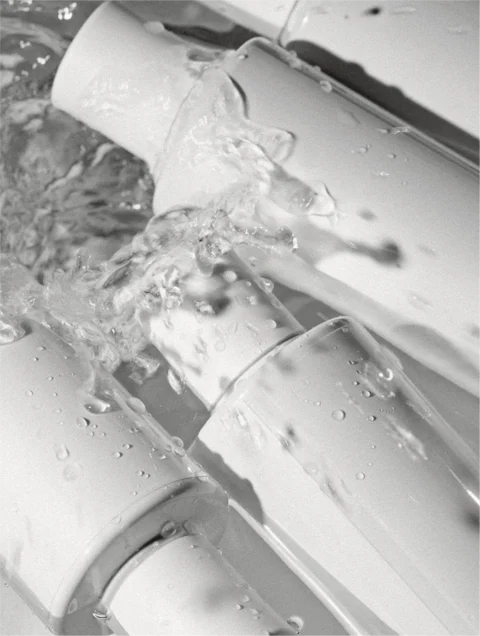 Close-up of water flowing through a faucet
