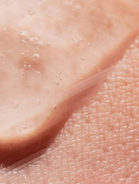 Close-up of a person's skin with a visible hair.
