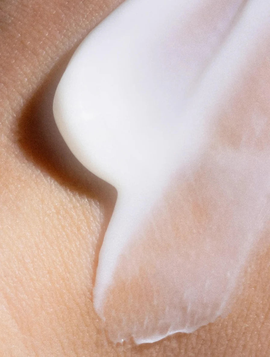 Close-up of a skincare product being applied to skin