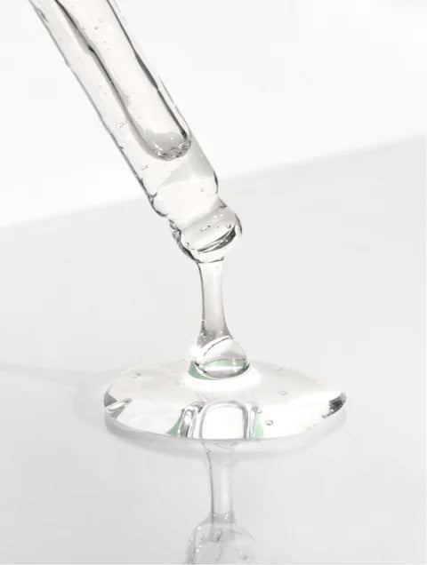 Close-up of a clear glass wine glass on a white background