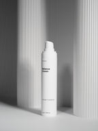 White cream bottle labeled 'Balance Cream' on a gray background