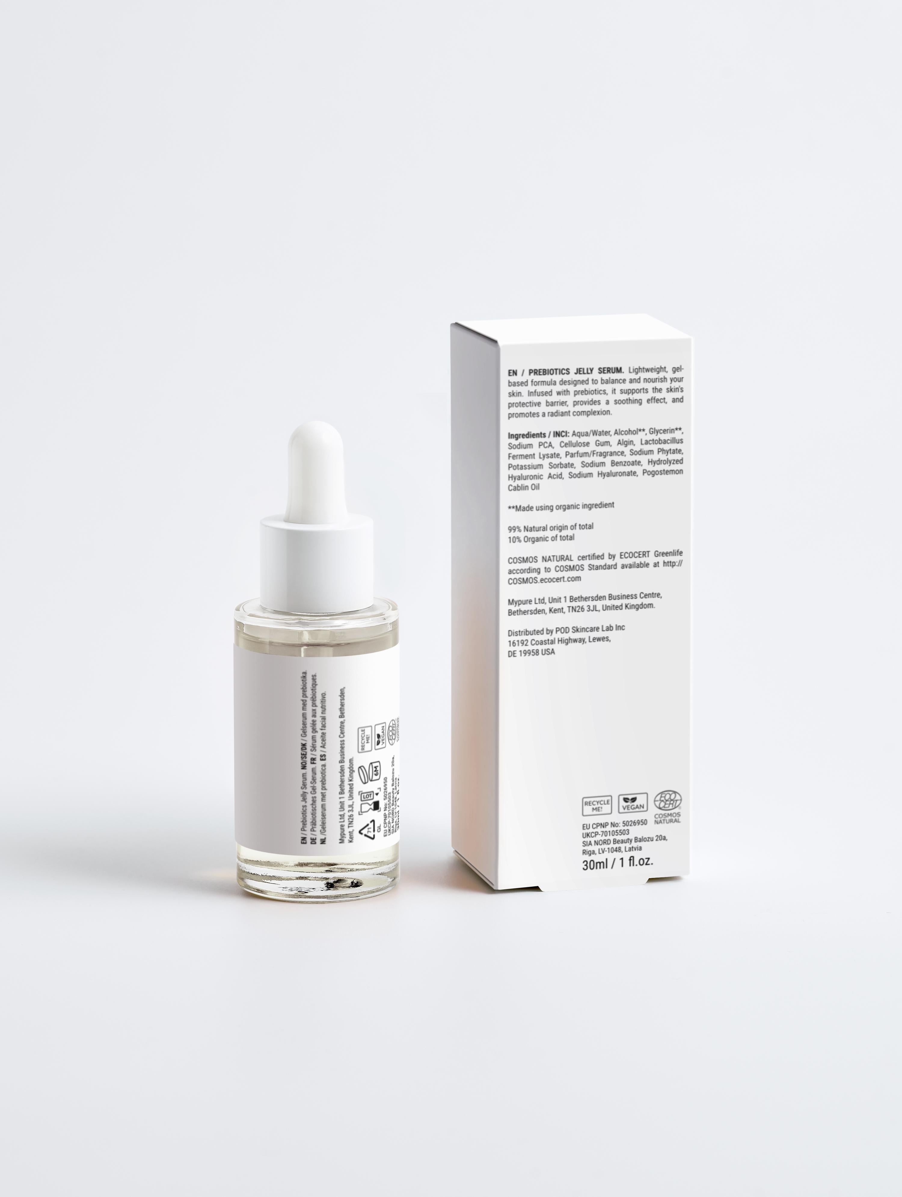 Skincare serum bottle with dropper and its packaging on a white background