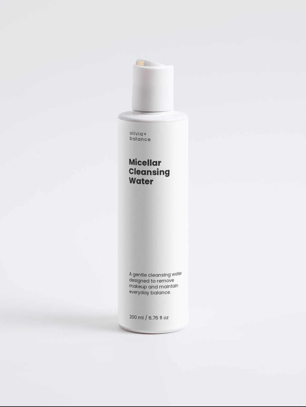 White bottle of Micellar Cleansing Water on a light gray background