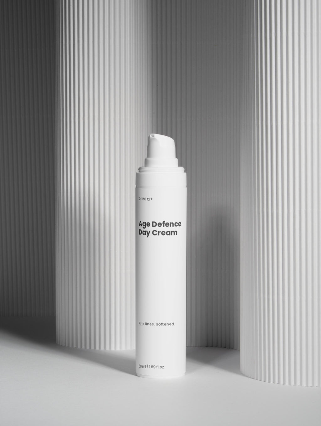 White bottle of 'The Daily Veil' on a gray background