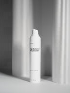 White bottle of 'The Daily Veil' on a gray background