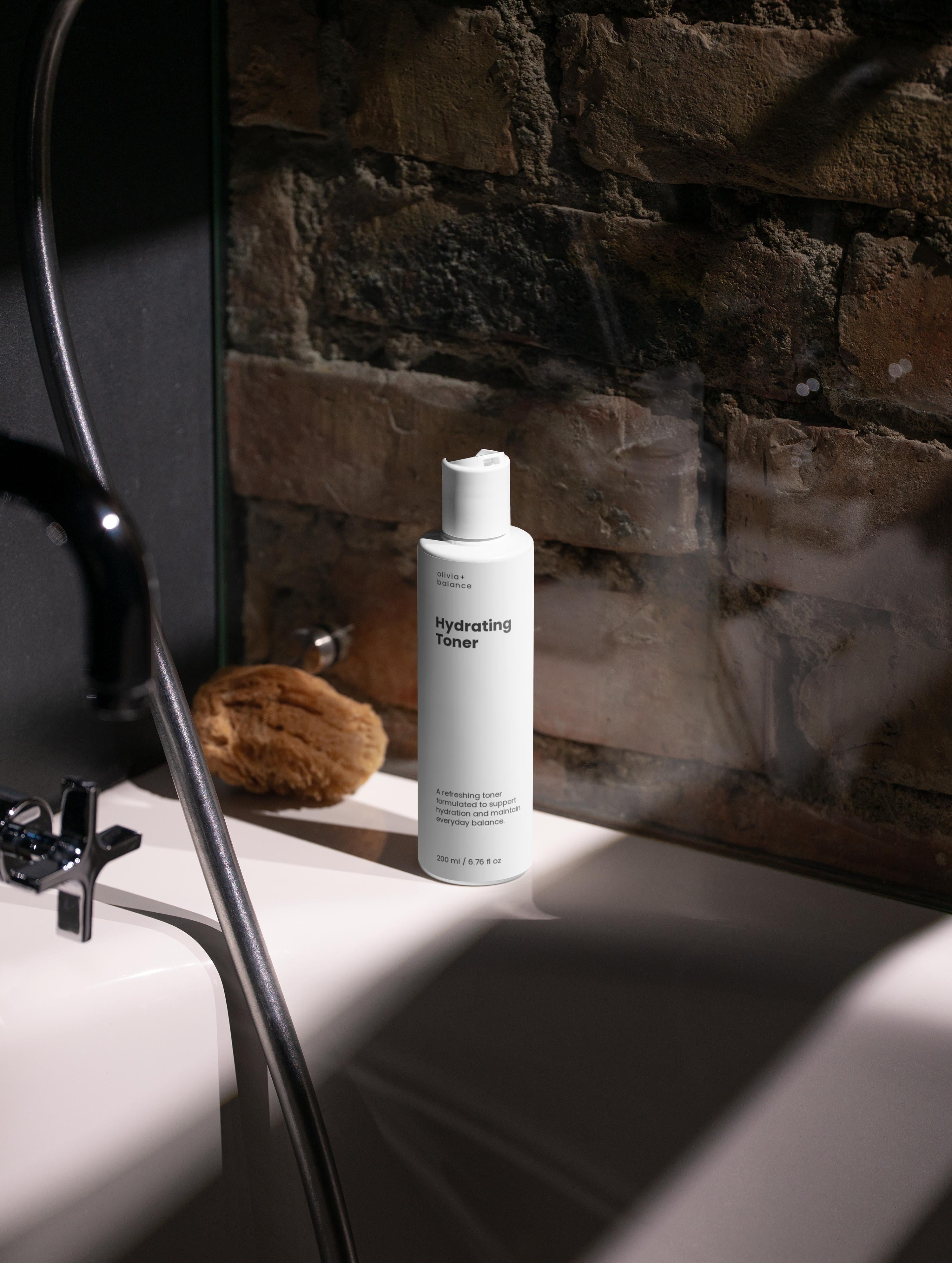 White bottle of Verai Skin product on a bathroom counter with a brick wall background